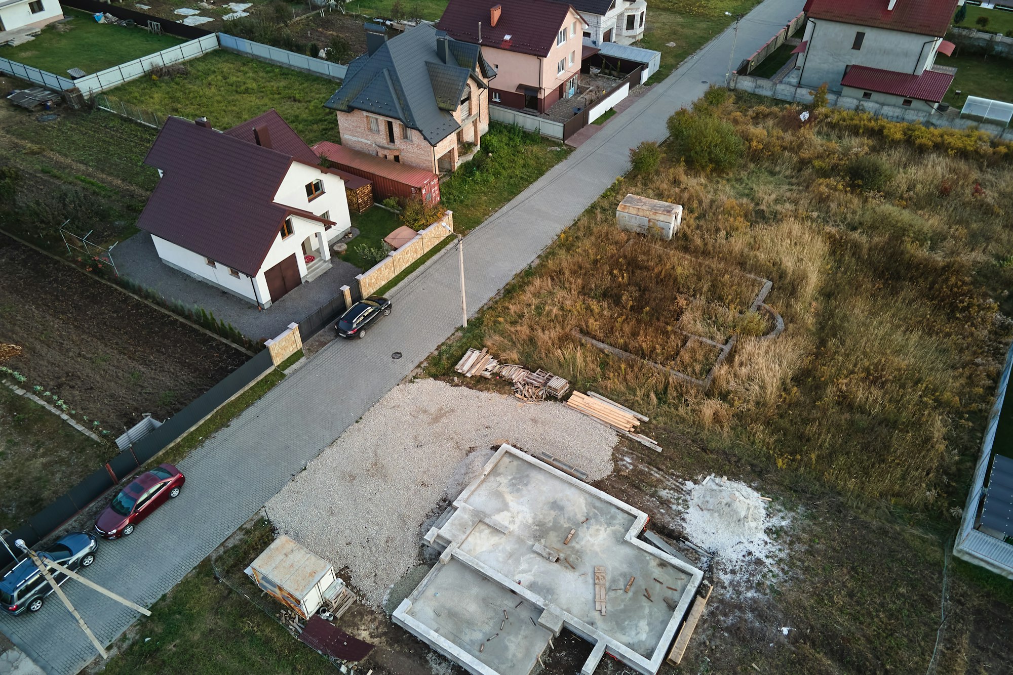 Aerial view of building works of new house concrete foundation on construction site